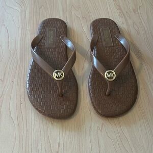Michael Kors Tan Sandals/Flip Flops with Gold Logo